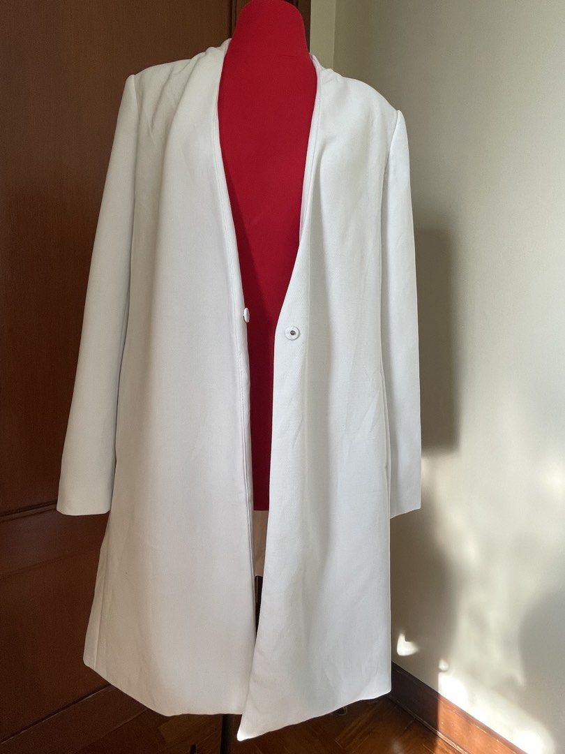 Zara Basic White Coat (Category: Coats, Jackets and Outerwear) located in Quezon City. Submitted by mymini.closet (Listing ID 1438502791, Image 1). Description: - Zara Basic white coat - Size: S git up to Large - Features a longline design - Single button closure - Simple and elegant style - Made in Vietnam - bought in vietnam - minor tear in the lining at the back Not noticeable when wear .