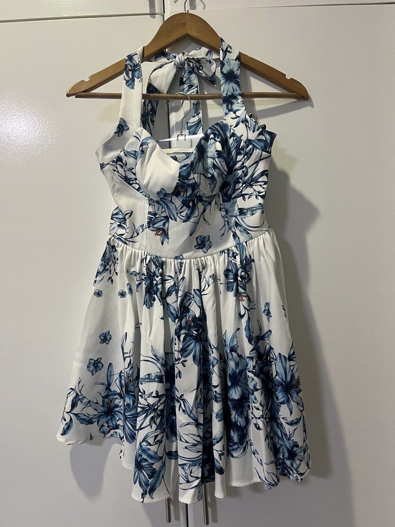 Zara Floral Halter Dress (Category: Dresses) located in Makati City. Submitted by jcc999 (Listing ID 1438570301, Image 3). Description: - Zara floral dress - Size: S - Color: Blue and white floral print - Design: Halter neckline, flared skirt - Made in: Morocco - Perfect for: Summer outings, special occasions - Silhouette: Flattering.