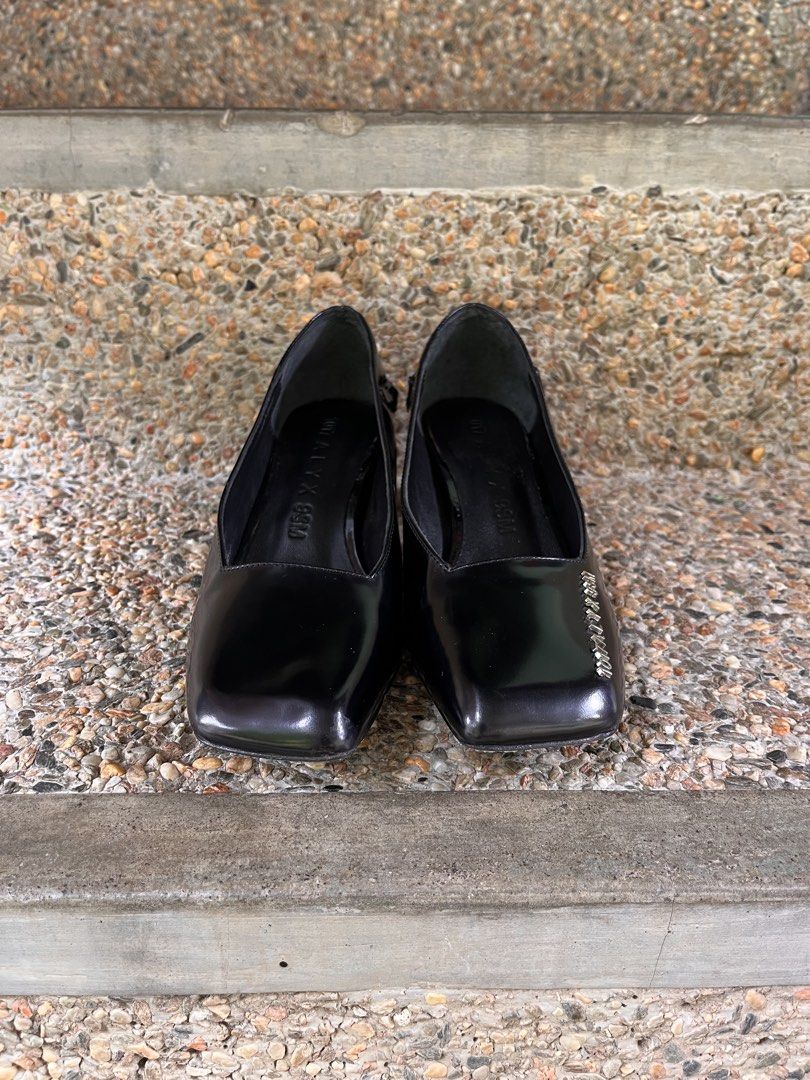 1017 ALYX 9SM Black Patent Medium Heels (Category: Heels) located in Agdangan. Submitted by excommunicado_ (Listing ID 1438742057, Image 2). Description: 1017 ALYX 9SM Black Patent Medium Heels Size 37 on tag (24cm) Heel height - 2” Very good used condition Issue: missing curb chain ankle strap Patent calfskin heels in black. Logo hardware at square toe. Detachable curb chain ankle strap. Curved stacked leather cylindrical heel. Tonal leather sol