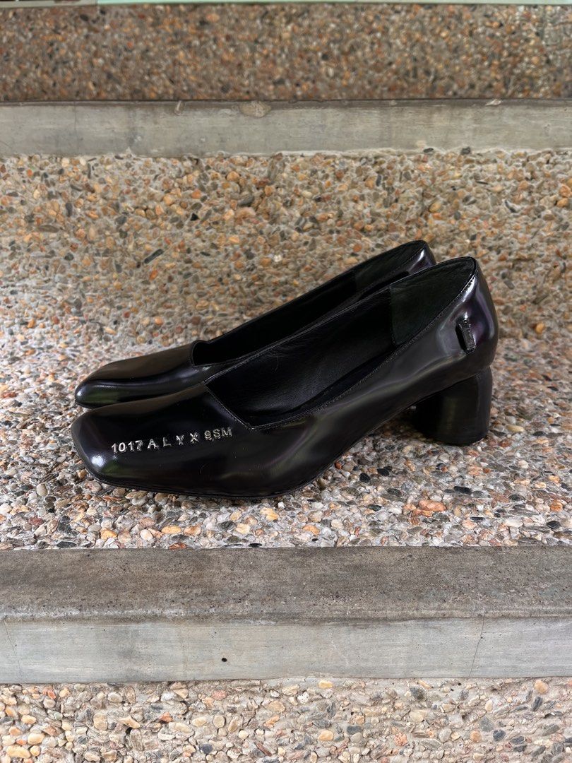1017 ALYX 9SM Black Patent Medium Heels (Category: Heels) located in Agdangan. Submitted by excommunicado_ (Listing ID 1438742057, Image 3). Description: 1017 ALYX 9SM Black Patent Medium Heels Size 37 on tag (24cm) Heel height - 2” Very good used condition Issue: missing curb chain ankle strap Patent calfskin heels in black. Logo hardware at square toe. Detachable curb chain ankle strap. Curved stacked leather cylindrical heel. Tonal leather sol