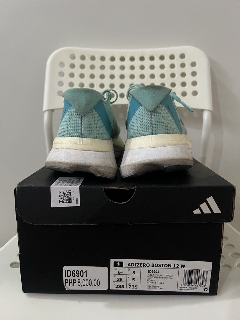Adidas Adizero Boston 12 W Running Shoes (Category: Sneakers) located in Bacoor. Submitted by eryljanyn (Listing ID 1438797366, Image 2). Description: - Adidas Adizero Boston 12 W running shoes - Eye-catching teal and orange design - Size: UK 5, US 6, EUR 38 - Features Lightstrike Pro midsole for enhanced cushioning - Equipped with a durable Continental outsole - Comes with the original box - Speed shoes - Well used.