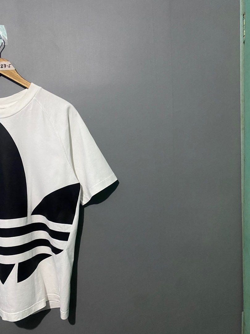 Adidas Trefoil T-shirt (Category: Tshirts & Polo Shirts ) located in Mandaluyong City. Submitted by rileyfreeman (Listing ID 1438865290, Image 3). Description: - White Adidas Trefoil t-shirt - Features a large black Trefoil logo - Classic crew neck design - Short sleeves - Size and product code visible on the tag Adidas Big Trefoil Boxy Tee Size: Xsmall on tag Dimes: W20 L27.5 No issue , may need lang wash Good Condition P599 only .