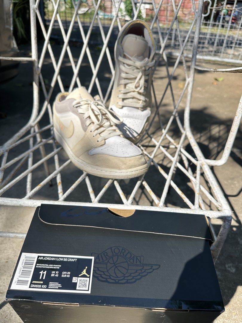 Air Jordan 1 Low SE Craft (Category: Sneakers) located in Manila. Submitted by jampasabuy.jpn (Listing ID 1438826390, Image 2). Description: - Air Jordan 1 Low SE Craft sneakers - Size 11 - Cream and white colorway - Suede and leather upper - Includes original box - Classic design with Nike swoosh - Perfect for casual wear.
