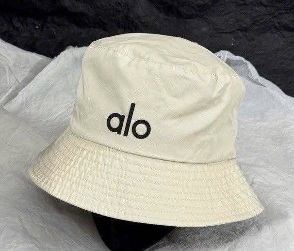 ALO YOGA Weekender Bucket Hat (Category: Hats & Beanies) located in Manila. Submitted by manifestd. (Listing ID 1438747030, Image 1). Description: ALO YOGA Weekender Bucket Hat ✔️Cream, never worn (not my style, given as a gift, rfs: decluttering) ✔️Unisex, free size, classic bucket hat design ✔️Embroidered ALO logo ✔️Lalamove/J&T ready *also listed on my main acct archivedpieces.