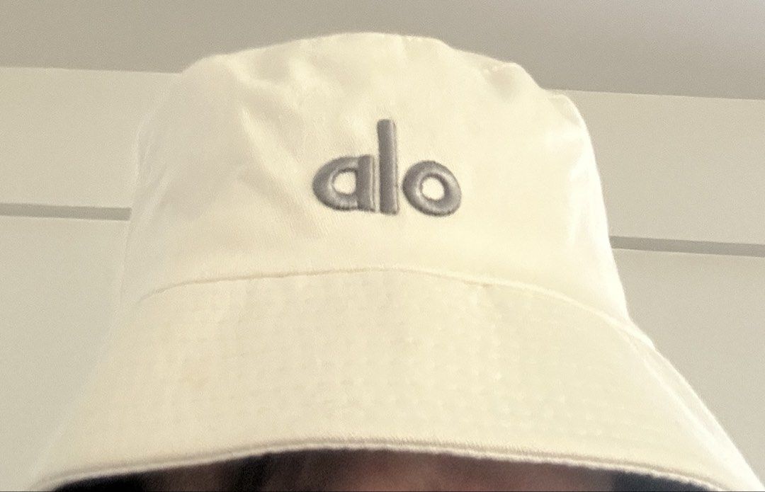 ALO YOGA Weekender Bucket Hat (Category: Hats & Beanies) located in Manila. Submitted by manifestd. (Listing ID 1438747030, Image 3). Description: ALO YOGA Weekender Bucket Hat ✔️Cream, never worn (not my style, given as a gift, rfs: decluttering) ✔️Unisex, free size, classic bucket hat design ✔️Embroidered ALO logo ✔️Lalamove/J&T ready *also listed on my main acct archivedpieces.