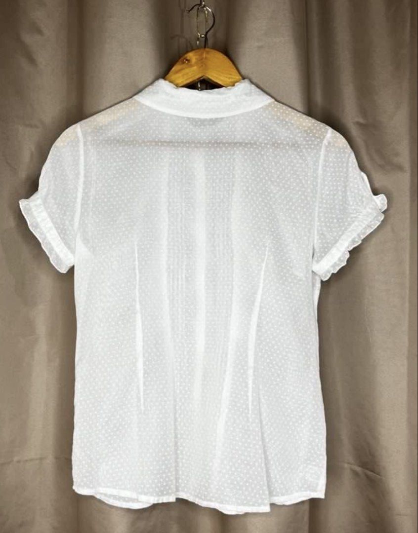 American Eagle Outfitters White Polka Dot Blouse (Category: Blouses) located in Malabon City. Submitted by igigs (Listing ID 1438756966, Image 3). Description: - American Eagle Outfitters blouse - White with polka dot pattern - Ruffled detailing - Short sleeves - Collared neckline - Button-down closure - Size 6 - Made in China.
