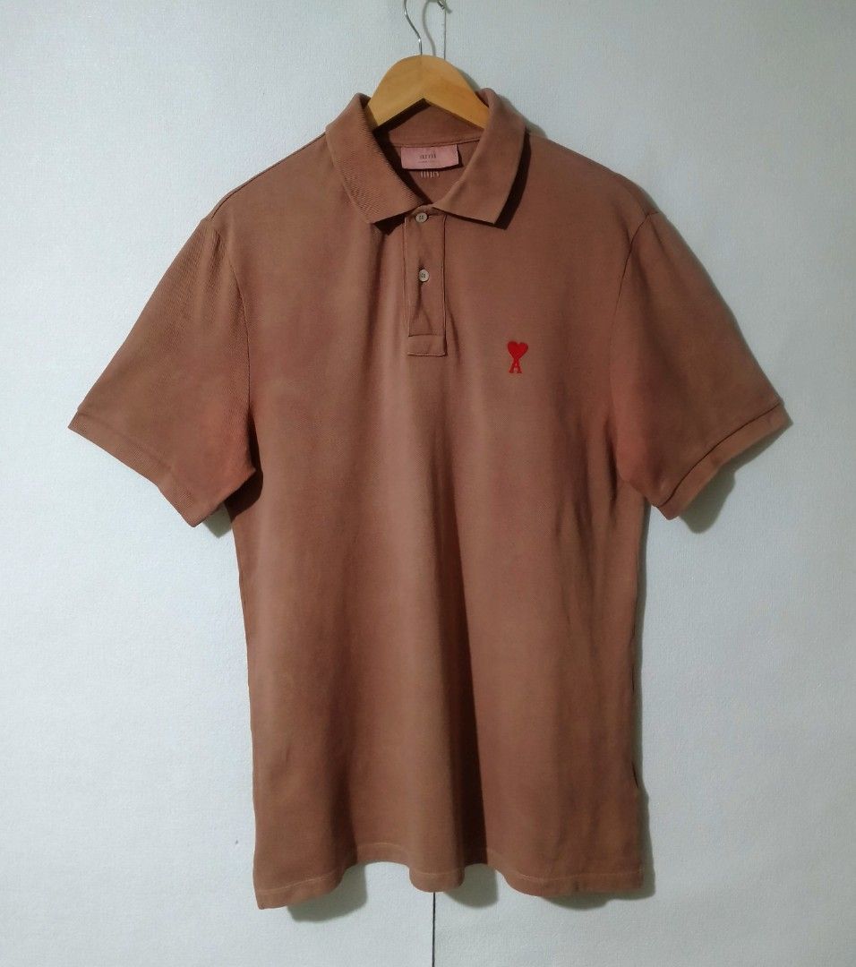 AMI Paris Polo Shirt (Category: Tshirts & Polo Shirts ) located in Ozamiz City. Submitted by jh_pr0 (Listing ID 1438799957, Image 1). Description: - AMI Paris polo shirt - Brown color - AMI logo on chest and back - Short sleeves - Classic polo collar - Comfortable fabric - Perfect for casual wear - Includes brand tag - 21x30 -issue deodorant stain not noticeable.