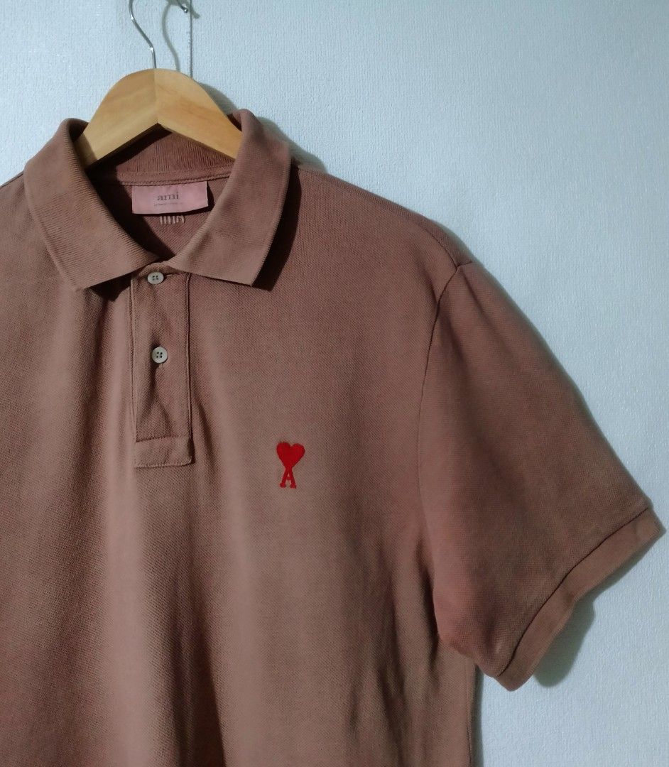 AMI Paris Polo Shirt (Category: Tshirts & Polo Shirts ) located in Ozamiz City. Submitted by jh_pr0 (Listing ID 1438799957, Image 3). Description: - AMI Paris polo shirt - Brown color - AMI logo on chest and back - Short sleeves - Classic polo collar - Comfortable fabric - Perfect for casual wear - Includes brand tag - 21x30 -issue deodorant stain not noticeable.