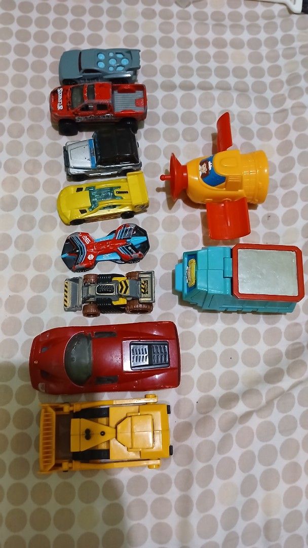 Assorted Toy Cars (Category: Vehicle & Diecast Models) located in Imus. Submitted by dahdahlicious (Listing ID 1438807914, Image 3). Description: - Variety of toy cars for kids. - Includes: - Yellow airplane toy - Blue and red race car - Red sports car - Yellow construction vehicle - Many other cars of different colors and designs. - Great for imaginative play!.
