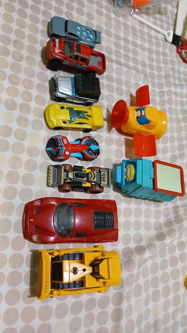 Assorted Toy Cars (Category: Vehicle & Diecast Models) located in Imus. Submitted by dahdahlicious (Listing ID 1438807914, Image 2). Description: - Variety of toy cars for kids. - Includes: - Yellow airplane toy - Blue and red race car - Red sports car - Yellow construction vehicle - Many other cars of different colors and designs. - Great for imaginative play!.
