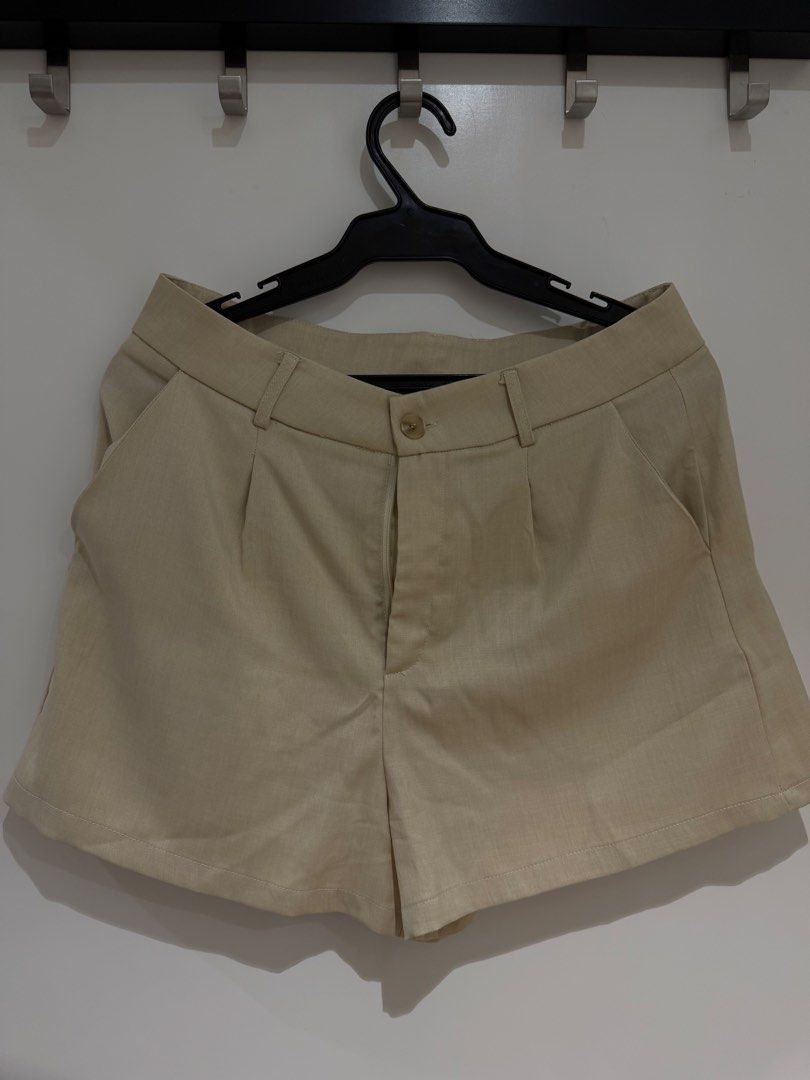 Beige Vest and Shorts Set - Size L (Category: Sets or Coordinates) located in Makati City. Submitted by delr2191 (Listing ID 1438740148, Image 3). Description: - Beige vest and shorts set - Vest features a V-neck and button closure - Shorts have a button and zipper closure with pleats - Vest size: L - Made in China Used once.