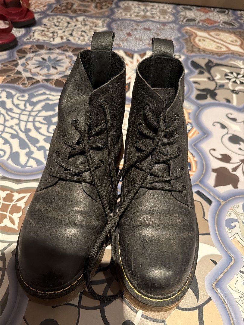Black Leather Boots (Category: Boots) located in Singapore. Submitted by lanameow (Listing ID 1438815146, Image 1). Description: - Classic Dr. Martens style black leather boots - Lace-up design - Sturdy soles for durability - Perfect for everyday wear - Stylish and comfortable - Well-loved condition.