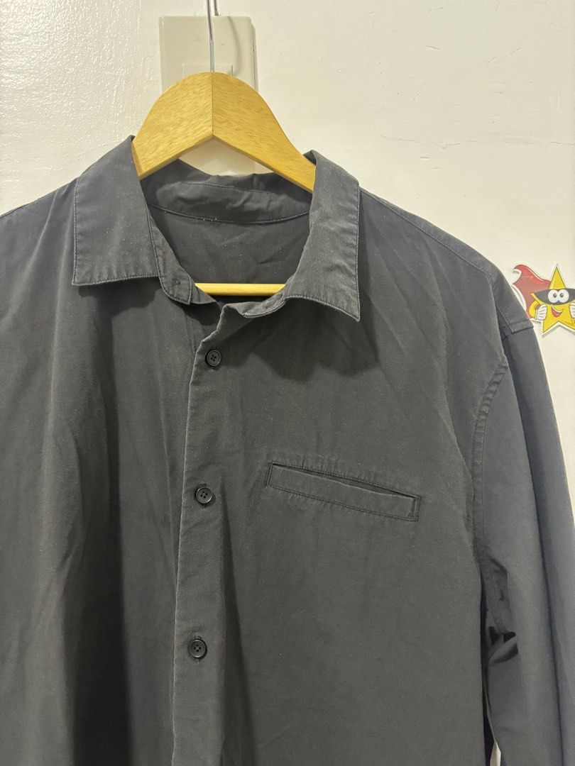 Black Long Sleeve Shirt (Category: Tshirts & Polo Shirts ) located in Baguio. Submitted by usedcondition (Listing ID 1438779561, Image 2). Description: - Black long sleeve shirt - Button-down style - Single chest pocket - Unique perforated cuffs - Classic collar - Lightweight material - Versatile for various occasions.