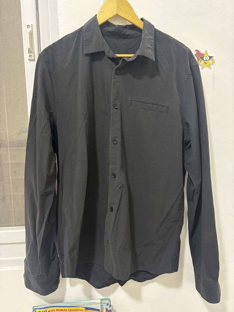 Black Long Sleeve Shirt (Category: Tshirts & Polo Shirts ) located in Baguio. Submitted by usedcondition (Listing ID 1438779561, Image 1). Description: - Black long sleeve shirt - Button-down style - Single chest pocket - Unique perforated cuffs - Classic collar - Lightweight material - Versatile for various occasions.