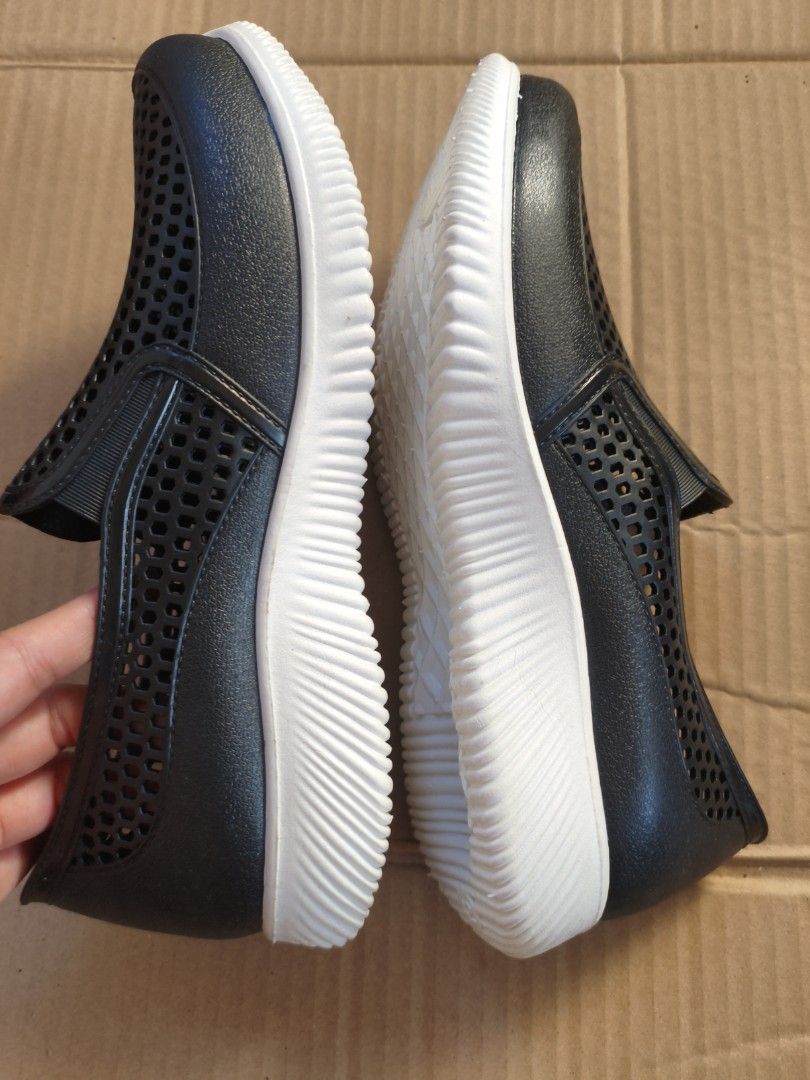 Black Perforated Slip-on Rain Shoes (Category: Flats & Sandals) located in Pasig City. Submitted by coolphoenix-29ac (Listing ID 1438878160, Image 3). Description: - Far Light slip-on shoes - Size 42 - Perforated design - White sole - Made of a rubber-like material - Textured soles for grip.