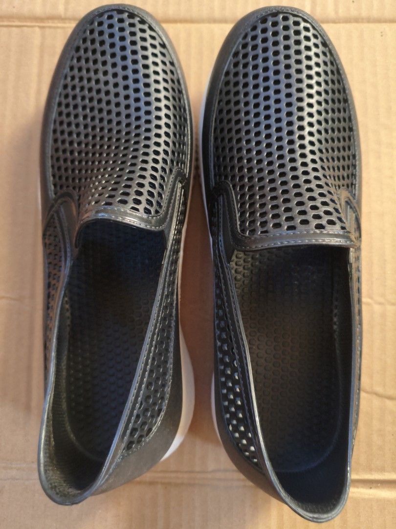 Black Perforated Slip-on Rain Shoes (Category: Flats & Sandals) located in Pasig City. Submitted by coolphoenix-29ac (Listing ID 1438878160, Image 2). Description: - Far Light slip-on shoes - Size 42 - Perforated design - White sole - Made of a rubber-like material - Textured soles for grip.