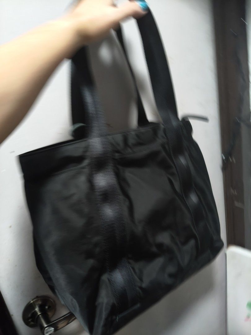 Black Tote Bag with Zipper Closure (Category: Tote Bags) located in Manila. Submitted by stuff_finder (Listing ID 1438876056, Image 2). Description: - Black tote bag - Zipper closure - Spacious interior - Durable material - Sturdy straps - Gold-colored zipper - guaranteed authentic ykk zip.