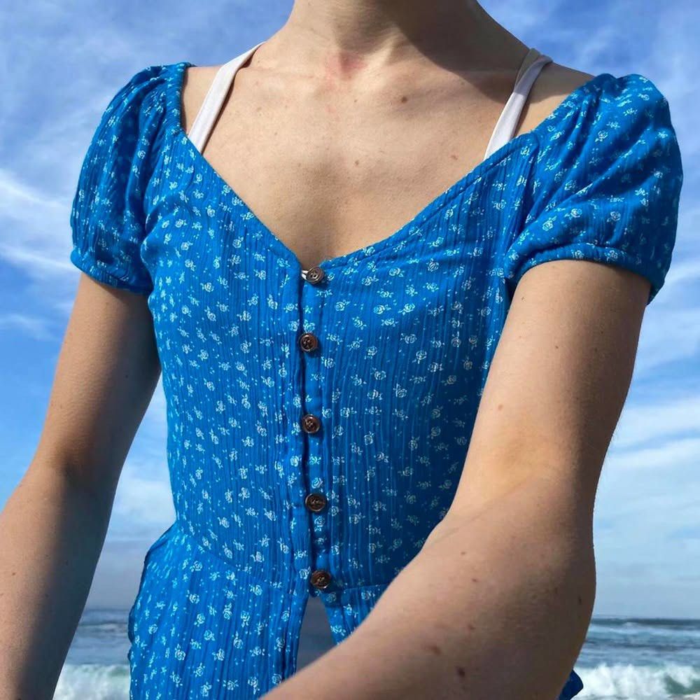 Blue Floral Button-Up Top (Category: Blouses) located in Manila. Submitted by kat_declutter (Listing ID 1438740589, Image 2). Description: -photos when worn are not mine, got it for your reference (ctto) - Blue floral top - Button-up design - Short, puffed sleeves - Flattering peplum hem - V-neckline - Textured fabric - Fitted silhouette - Lightweight material.