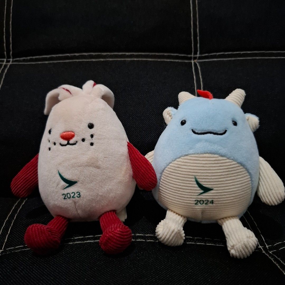 Cathay Pacific Plush Toys 2023 & 2024 (Category: Plushies & Soft Toys) located in Baliuag. Submitted by ahgashop. (Listing ID 1438783352, Image 1). Description: - Adorable Cathay Pacific plush toys - Year of the Dragon (2024) - Year of the Rabbit (2023) - Ideal for Cathay Pacific collectors and lovers - sold as set only.