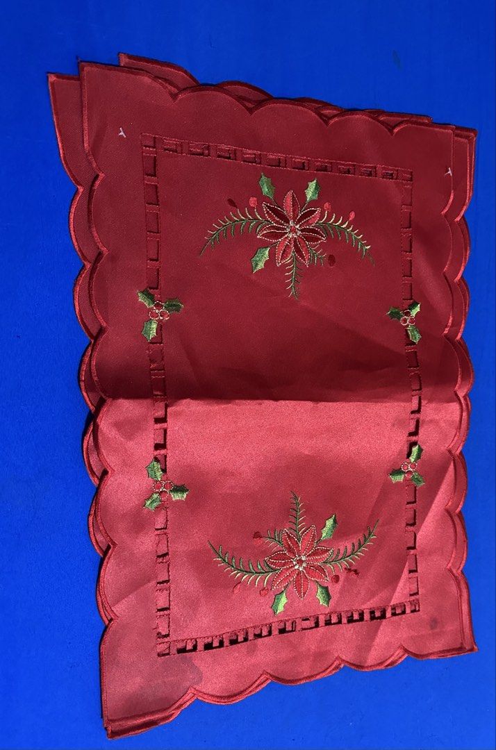 Christmas Red Placemats Set 4-pc (take all) (Category: Other Home Decor) located in Caloocan City. Submitted by bingluces (Listing ID 1438694987, Image 2). Description: - Set of red placemats - Scalloped edge design - Embroidered with poinsettias and holly - Festive Christmas theme - Made of a smooth, satin-like material .