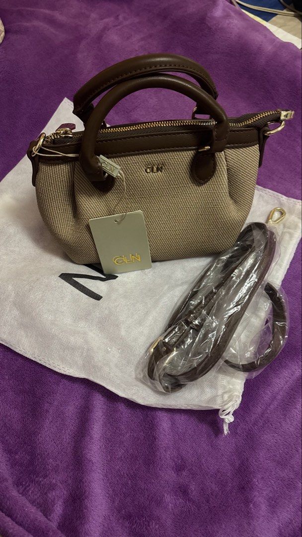 CLN Handbag with Shoulder Strap (Category: Shoulder Bags) located in Manila. Submitted by euriceabad45430 (Listing ID 1438797396, Image 3). Description: - CLN handbag - Brown and beige color - Detachable shoulder strap - Top handle - Zipper closure - Includes dust bag - CLN tag attached - Unused condition -No paperbag.
