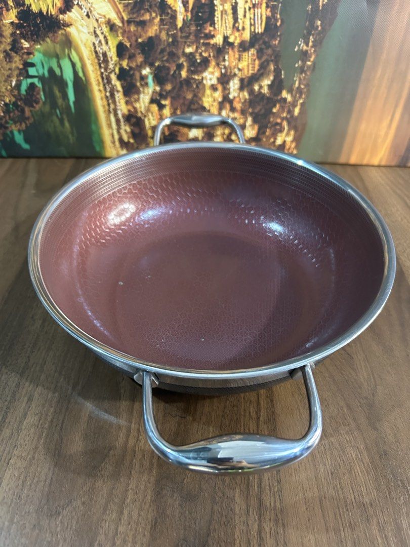 Cookcel Ceramic Frying Pan 24cm (Category: Cookware & Accessories) located in Angeles City. Submitted by kimkant06043026 (Listing ID 1438723075, Image 1). Description: - Cookcel frying pan, 24cm. - Features a copper-colored interior. - Stainless steel exterior with two handles. - Black bottom with geometric pattern. - Cookcel brand and "Ceramic" label on the bottom. - Designed in Korea..
