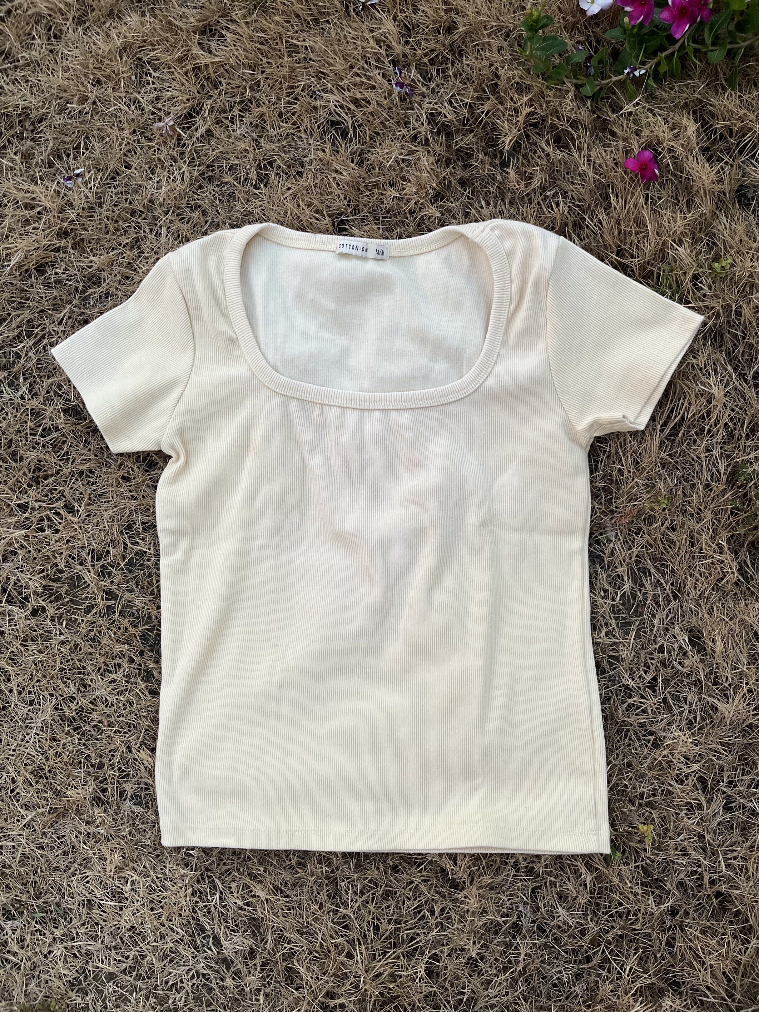 Cotton On Square Neck Ribbed Top (Category: Sleeveless) located in Manila. Submitted by kat_declutter (Listing ID 1438831918, Image 1). Description: - Cream-colored ribbed top from Cotton On - Features a square neckline - Short sleeves - Fitted style - Soft and comfortable fabric - Versatile for different outfits.