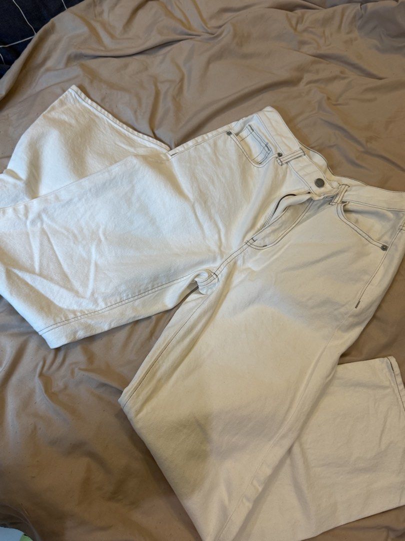 Cream-colored Jeans (Category: Jeans) located in Muntinlupa City. Submitted by em_prelovedx (Listing ID 1438737165, Image 2). Description: - Cream-colored straight-leg jeans - Visible stitching details - Button and zipper closure - Medium-weight fabric.