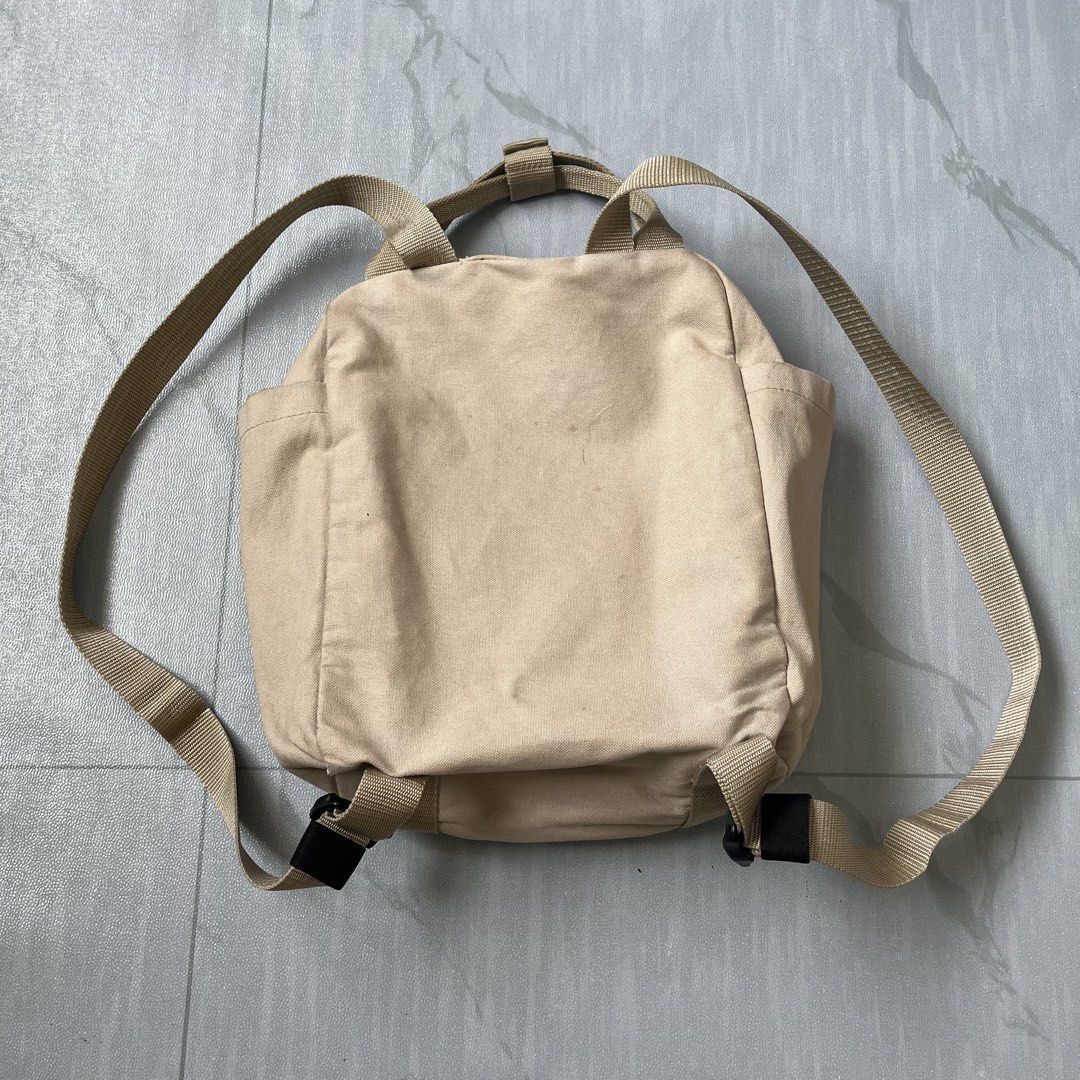 Danton 2-Way Mini Backpack Tote Bag (Authentic) (Category: Backpacks) located in Cavite. Submitted by newclassicwear (Listing ID 1438708324, Image 3). Description: Excellent Condition. None Any Issues Only Need Minor Wash. - Versatile Danton 2-way bag - Can be used as a tote or backpack - Features: - Front pocket with snap closure - Two side pockets - Top handle - Adjustable shoulder straps - Danton logo on the front - Neutral beige color.