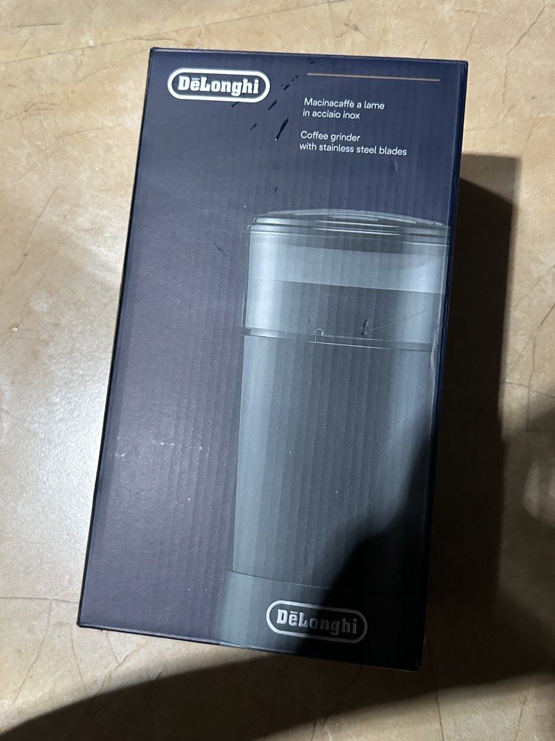 DeLonghi KG200 Coffee Grinder (Category: Coffee Machines & Makers) located in Antipolo. Submitted by colecshop (Listing ID 1438792122, Image 2). Description: - DeLonghi KG200 coffee grinder - Stainless steel blades - Black color - Includes original box - Made in China - Designed for grinding coffee beans - Clear container for bean visibility.