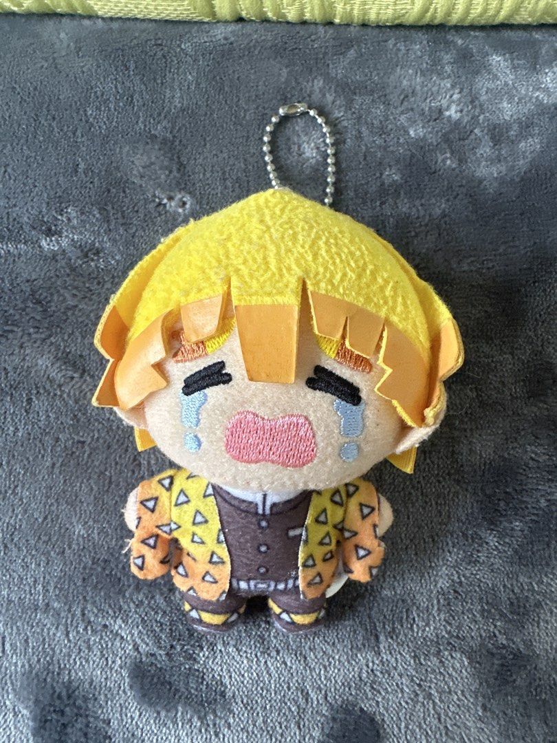 Demon Slayer Zenitsu Plush Keychain (Category: Plushies & Soft Toys) located in Cainta. Submitted by shopbyyna (Listing ID 1438726423, Image 1). Description: - Adorable Zenitsu plush keychain! - Features Zenitsu in his signature outfit and crying expression. - Includes a keychain attachment for easy carrying. - Officially licensed SEGA product. - Small and compact, ideal for collectors..