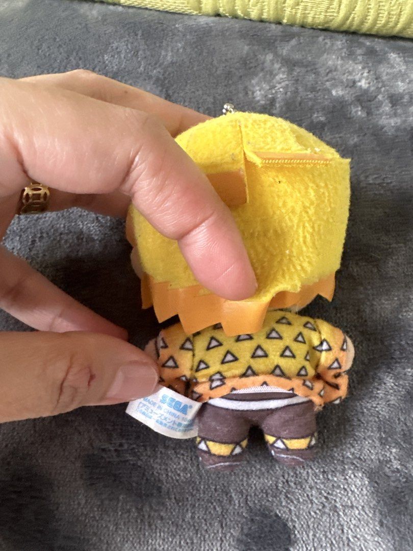 Demon Slayer Zenitsu Plush Keychain (Category: Plushies & Soft Toys) located in Cainta. Submitted by shopbyyna (Listing ID 1438726423, Image 2). Description: - Adorable Zenitsu plush keychain! - Features Zenitsu in his signature outfit and crying expression. - Includes a keychain attachment for easy carrying. - Officially licensed SEGA product. - Small and compact, ideal for collectors..
