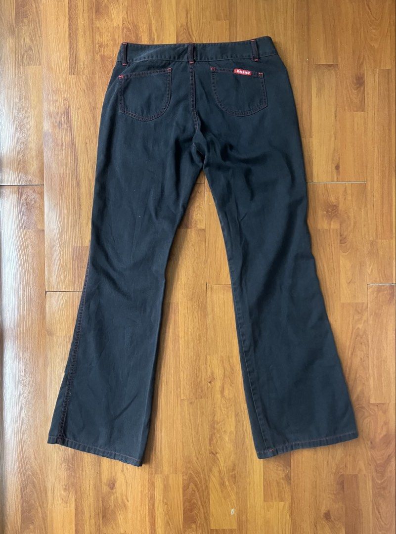 Dickies Black Flare Bootcut Pants with Red Contrast Stitching (Category: Jeans) located in Lipa City. Submitted by alexcollectionco (Listing ID 1438832499, Image 2). Description: Vintage Dickies black flare pants featuring striking red contrast stitching and a classic bootcut silhouette. These low-to-mid rise archival utility trousers perfectly channel the Y2K cyber grunge and indie sleaze aesthetic. Key Features • Brand: Dickies • Color: Faded b