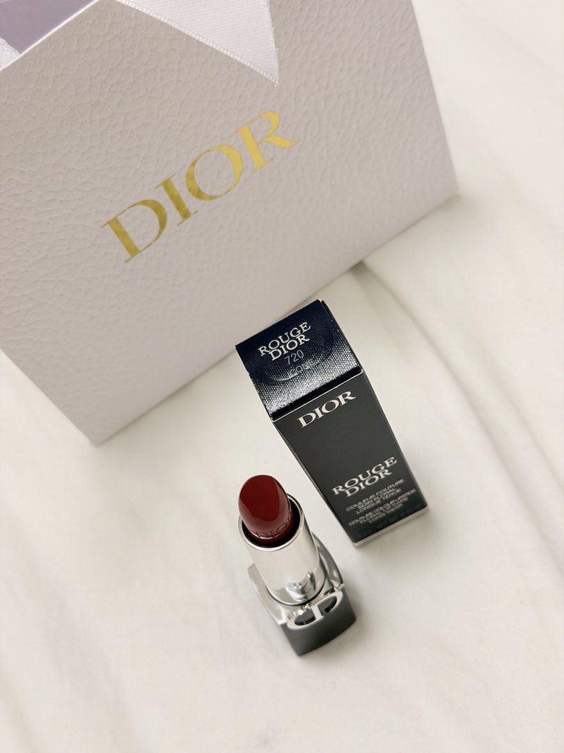 Dior Rouge Satin Lipstick Icone 720 (Category: Makeup) located in Quezon City. Submitted by jquimmyy (Listing ID 1438746531, Image 2). Description: - Bought it from Japan RFS: I have too many lipsticks/lipbalms, need to let some go - Authentic Dior Rouge Dior lipstick in shade 720 - Dior paper bag - Features a deep red color - Silver tube with the iconic Dior logo.