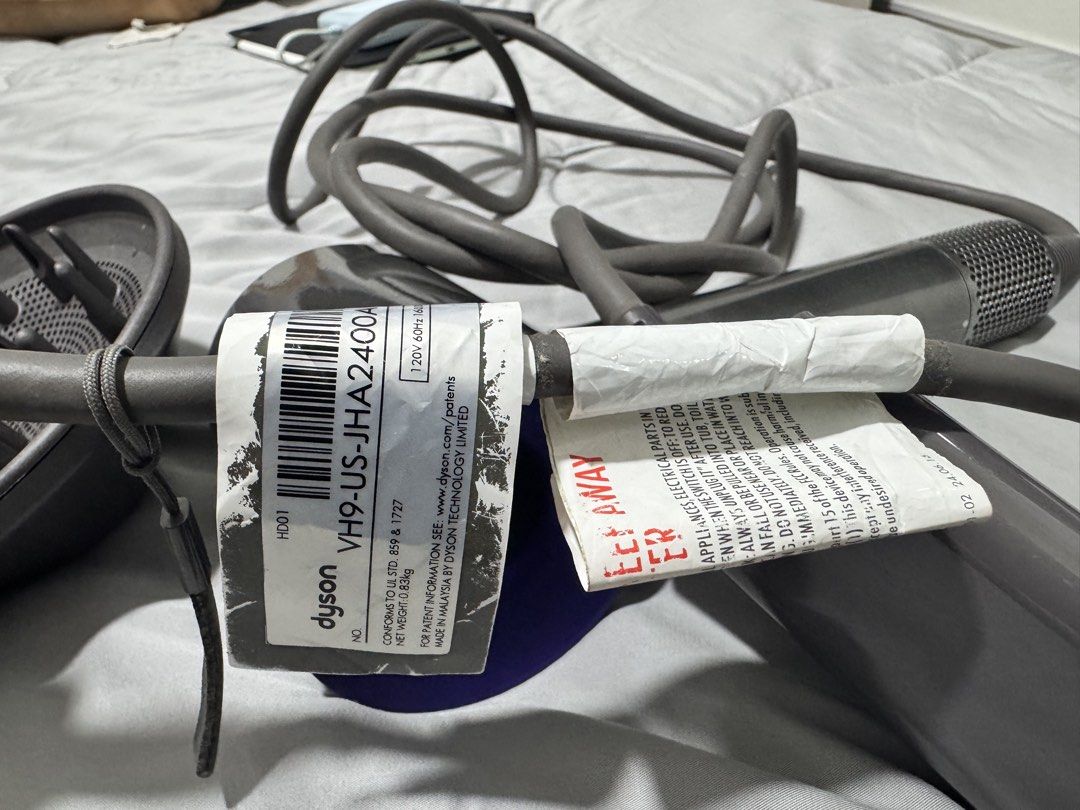 Dyson Supersonic Hair Dryer (Category: Hair) located in Quezon City. Submitted by nickole889510068 (Listing ID 1438814589, Image 2). Description: - Dyson Supersonic hair dryer - Color: Grey and Purple - Includes: Diffuser attachment, original power adapter - Model: VH9-US-JHA2400A - Features: Reset button, warning label on power cord 110 voltage bought in the US and haven’t used it much since moving here can be used with a transformer .