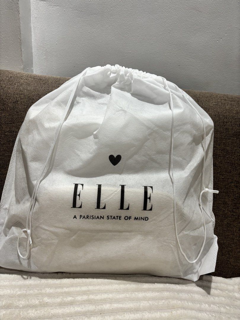 Elle Tote Bag (Category: Tote Bags) located in Mexico. Submitted by 3everything (Listing ID 1438821193, Image 1). Description: - Elle tote bag in cream color - Features: - Perforated design (one side) - Solid design (other side) - Includes: Dust bag and tags - Interior: Pocket and magnetic closure - Comes with: Handles and shoulder straps.