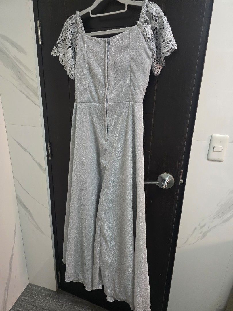 Formal Silver Lace Dress - Size M (Category: Dresses) located in Quezon City. Submitted by ohmystones_088 (Listing ID 1438811859, Image 2). Description: - Silver lace dress - Size M - Bust 34, Waist 28 - Intricate lace detailing on bodice and sleeves - Flattering silhouette with pleated design - Zipper closure at the back - Shiny material - Free Brooch and accessories - Only used once 😊wyswyg 😊 💕Due to the light and screen setting difference, 