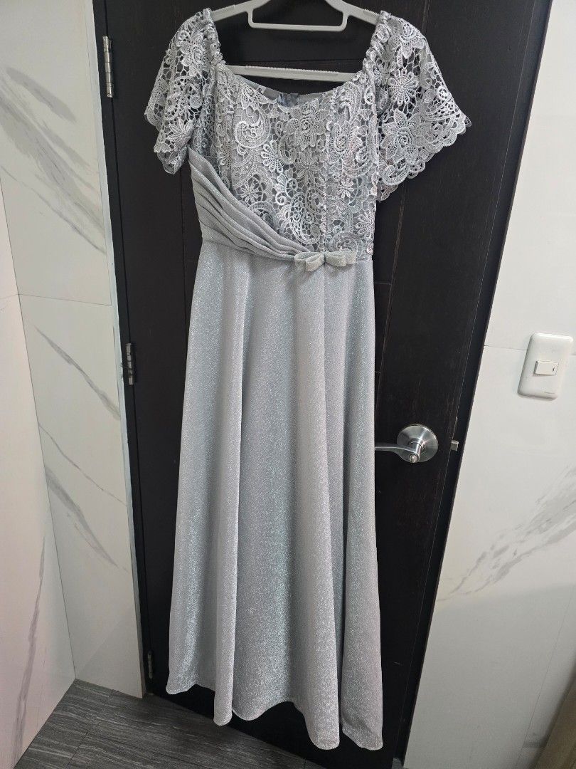 Formal Silver Lace Dress - Size M (Category: Dresses) located in Quezon City. Submitted by ohmystones_088 (Listing ID 1438811859, Image 1). Description: - Silver lace dress - Size M - Bust 34, Waist 28 - Intricate lace detailing on bodice and sleeves - Flattering silhouette with pleated design - Zipper closure at the back - Shiny material - Free Brooch and accessories - Only used once 😊wyswyg 😊 💕Due to the light and screen setting difference, 