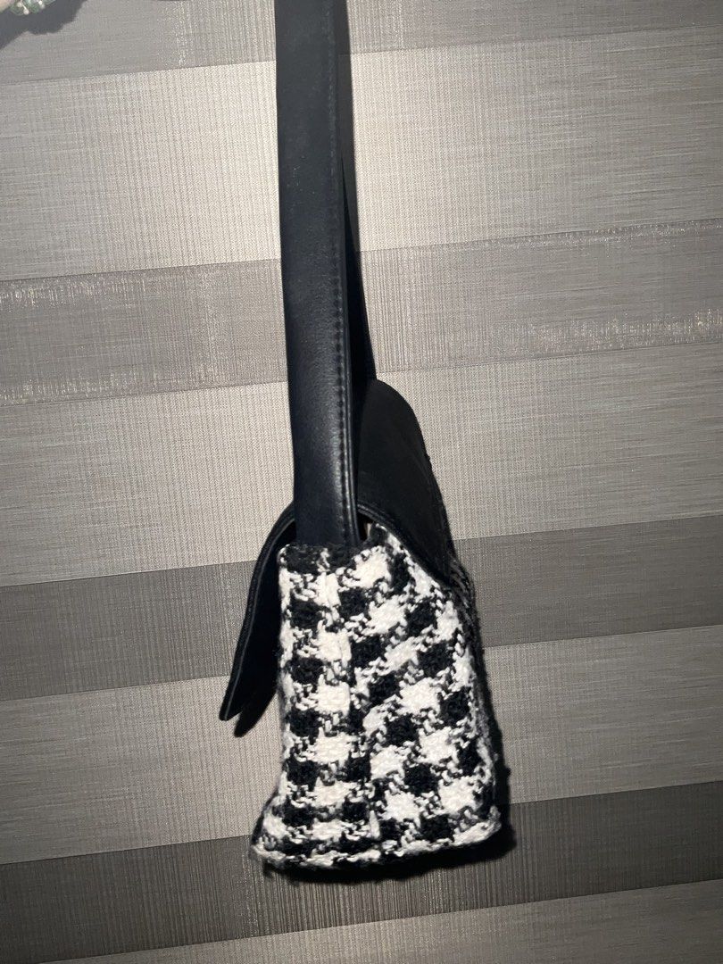 FORME Houndstooth Shoulder Bag (Category: Shoulder Bags) located in Mandaue City. Submitted by declutterwithkateee (Listing ID 1438725413, Image 2). Description: - FORME shoulder bag - Classic houndstooth pattern - Black leather flap and strap - Rectangular shape - Medium size - Suitable for everyday use - Long shoulder strap - Small logo detail - Very spacious inside.