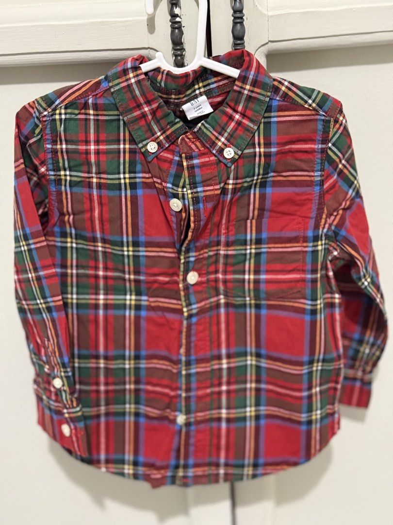 GAP Plaid Button-Down Shirt 2T toddler polo (Category: Babies & Kids Fashion) located in Las Pinas. Submitted by karenpee (Listing ID 1438765279, Image 1). Description: - GAP button-down shirt - Size: 2T - Classic plaid pattern (red, green, blue) - Long sleeves - Collared neckline - Button-down front - Chest pocket.