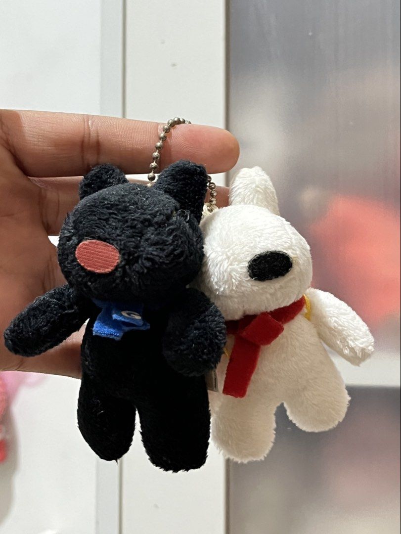 Gaspard et Lisa Plush Keychains (sold as set) (Category: Plushies & Soft Toys) located in San Antonio. Submitted by butter.miff (Listing ID 1438817592, Image 2). Description: - Adorable Gaspard et Lisa plush keychains. - Includes a black and a white plush toy. - White plush: red scarf, yellow bag. - Black plush: blue scarf. - Both have keychains. - Perfect for collectors or as an accessory..