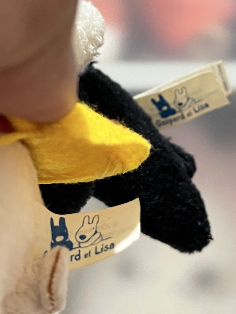 Gaspard et Lisa Plush Keychains (sold as set) (Category: Plushies & Soft Toys) located in San Antonio. Submitted by butter.miff (Listing ID 1438817592, Image 3). Description: - Adorable Gaspard et Lisa plush keychains. - Includes a black and a white plush toy. - White plush: red scarf, yellow bag. - Black plush: blue scarf. - Both have keychains. - Perfect for collectors or as an accessory..