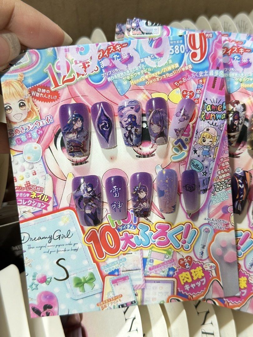 Genshin Impact Raiden Shogun Nail Art (Category: Hands & Nails) located in Quezon City. Submitted by mewggie (Listing ID 1438821664, Image 1). Description: - Genshin Impact nail art. - Features Raiden Shogun and other themed elements. - Perfect for anime fans. - Complete manicure set with various designs..