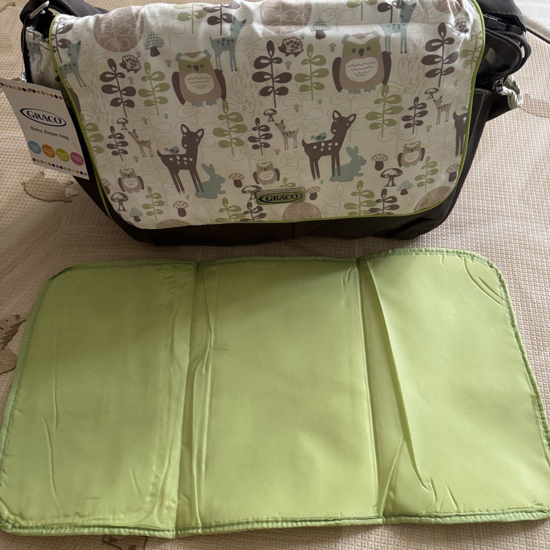 Graco Baby Diaper Bag (Category: Diaper Bags & Wetbags) located in Pasay City. Submitted by littlebebekidsstuff (Listing ID 1438749266, Image 3). Description: - Graco diaper bag with adorable woodland animal print. - Comes with a convenient changing pad. - Features multiple interior pockets for optimal organization. - Includes a comfortable shoulder strap. - Secure flap closure. Brandnew, but it has some washable stain inside due to storage that’