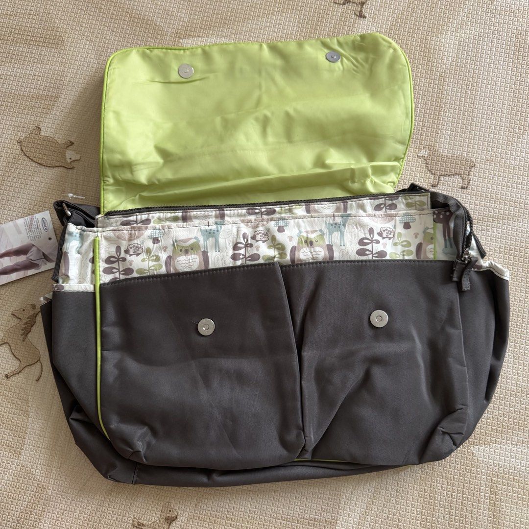 Graco Baby Diaper Bag (Category: Diaper Bags & Wetbags) located in Pasay City. Submitted by littlebebekidsstuff (Listing ID 1438749266, Image 2). Description: - Graco diaper bag with adorable woodland animal print. - Comes with a convenient changing pad. - Features multiple interior pockets for optimal organization. - Includes a comfortable shoulder strap. - Secure flap closure. Brandnew, but it has some washable stain inside due to storage that’