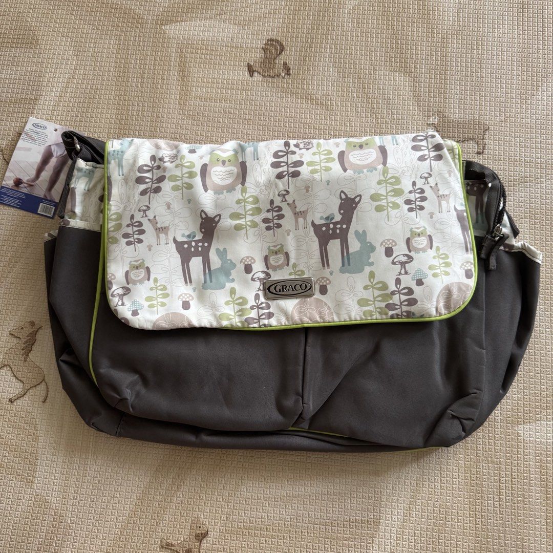 Graco Baby Diaper Bag (Category: Diaper Bags & Wetbags) located in Pasay City. Submitted by littlebebekidsstuff (Listing ID 1438749266, Image 1). Description: - Graco diaper bag with adorable woodland animal print. - Comes with a convenient changing pad. - Features multiple interior pockets for optimal organization. - Includes a comfortable shoulder strap. - Secure flap closure. Brandnew, but it has some washable stain inside due to storage that’