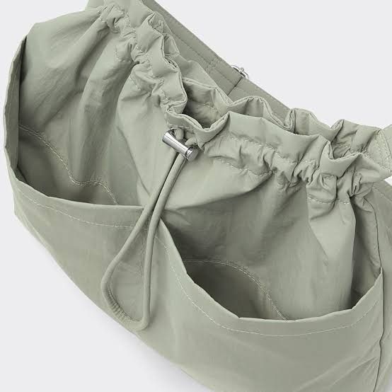 [GU Japan by Uniqlo] Black Drawstring Shoulder Bag (Category: Shoulder Bags) located in Muntinlupa City. Submitted by from_arcus (Listing ID 1438844310, Image 3). Description: - Bought from GU Ueno, Tokyo, Japan - Shoulder bag with drawstring closure - Adjustable strap for comfortable wear - Two exterior pockets - Available color: Black - Lightweight material - Simple and versatile design - Perfect for everyday use.