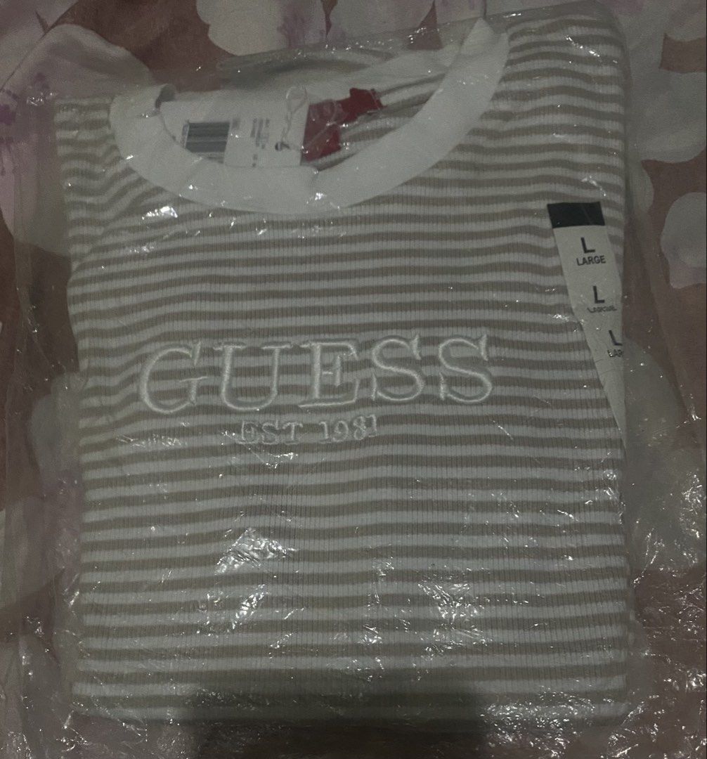 Guess Striped T-Shirt - Size L (Category: Shirts) located in Cavite. Submitted by Abril_07 (Listing ID 1438877034, Image 3). Description: - Guess striped t-shirt (stretchable) - Size: L - Features embroidered Guess logo - Round neckline, short sleeves - Made in Bangladesh.