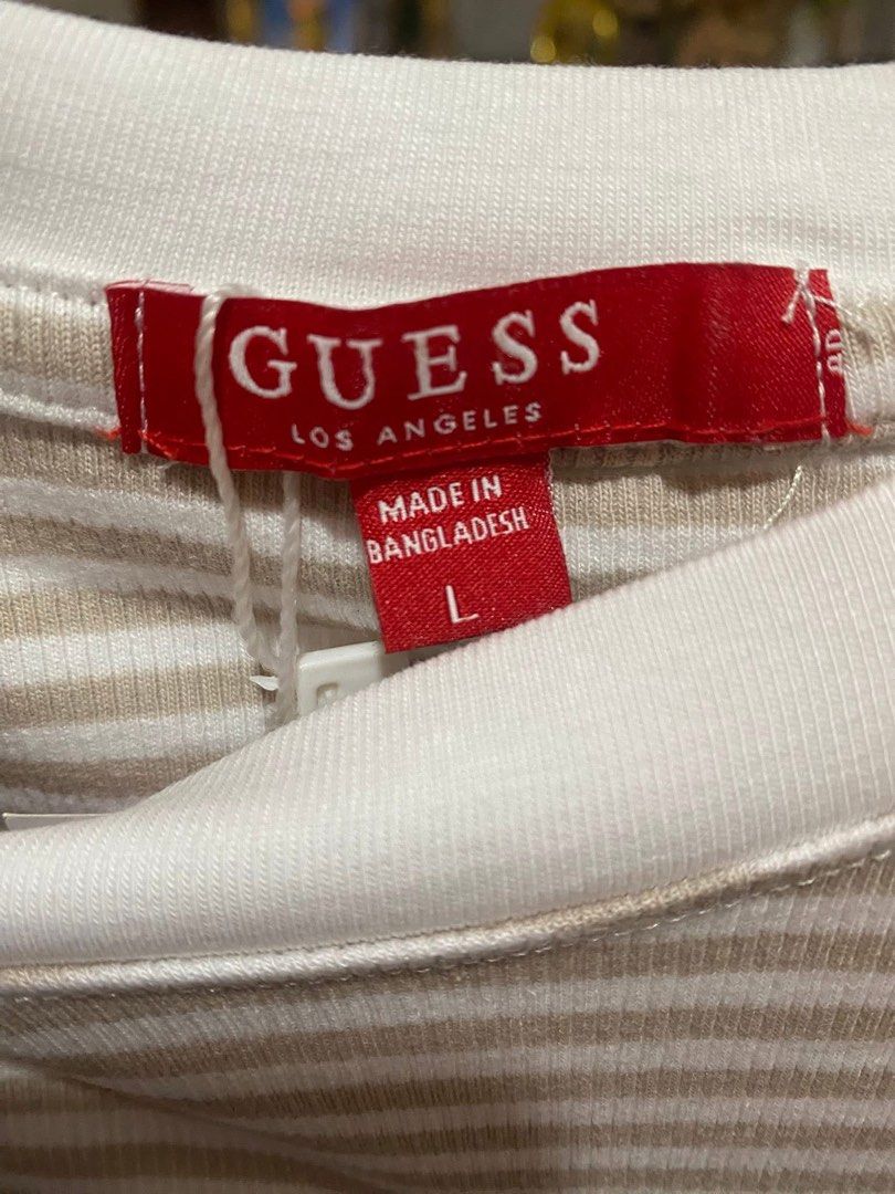 Guess Striped T-Shirt - Size L (Category: Shirts) located in Cavite. Submitted by Abril_07 (Listing ID 1438877034, Image 2). Description: - Guess striped t-shirt (stretchable) - Size: L - Features embroidered Guess logo - Round neckline, short sleeves - Made in Bangladesh.