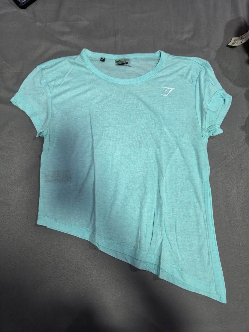 Gymnshark Assymmetrical Top in Light Turquoise (Category: Activewear) located in Quezon City. Submitted by snowflakes.specials (Listing ID 1438847896, Image 1). Description: Size XS Used Loose fit.